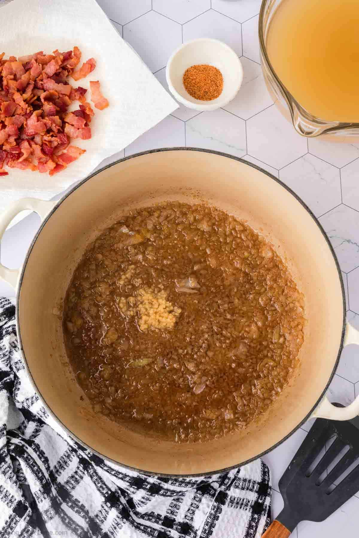 Adding in the minced garlic