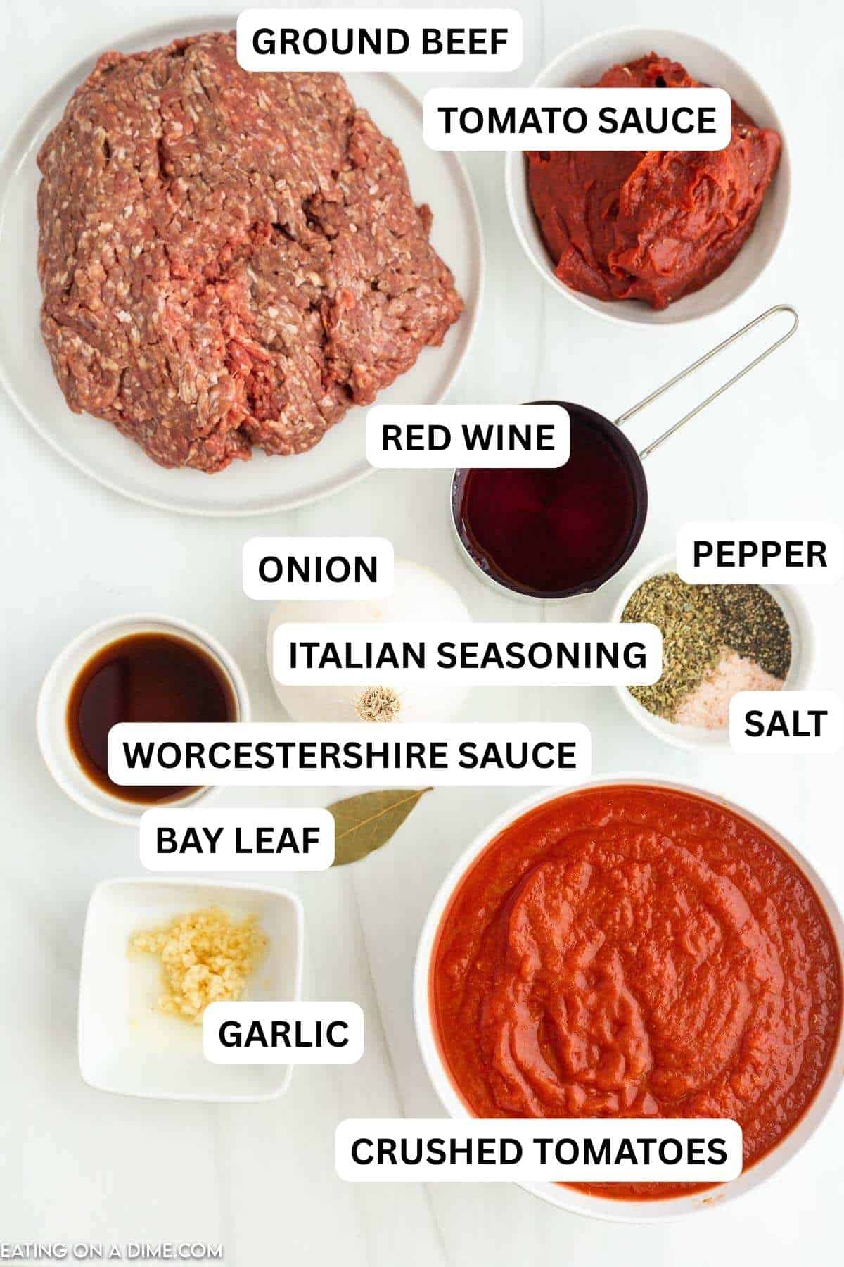 Ingredients for recipe: ground beef, onion, crushed tomatoes, tomato paste, Worcestershire sauce, Italian seasoning, minced garlic, salt and pepper, bay leaf, red wine and chicken broth.