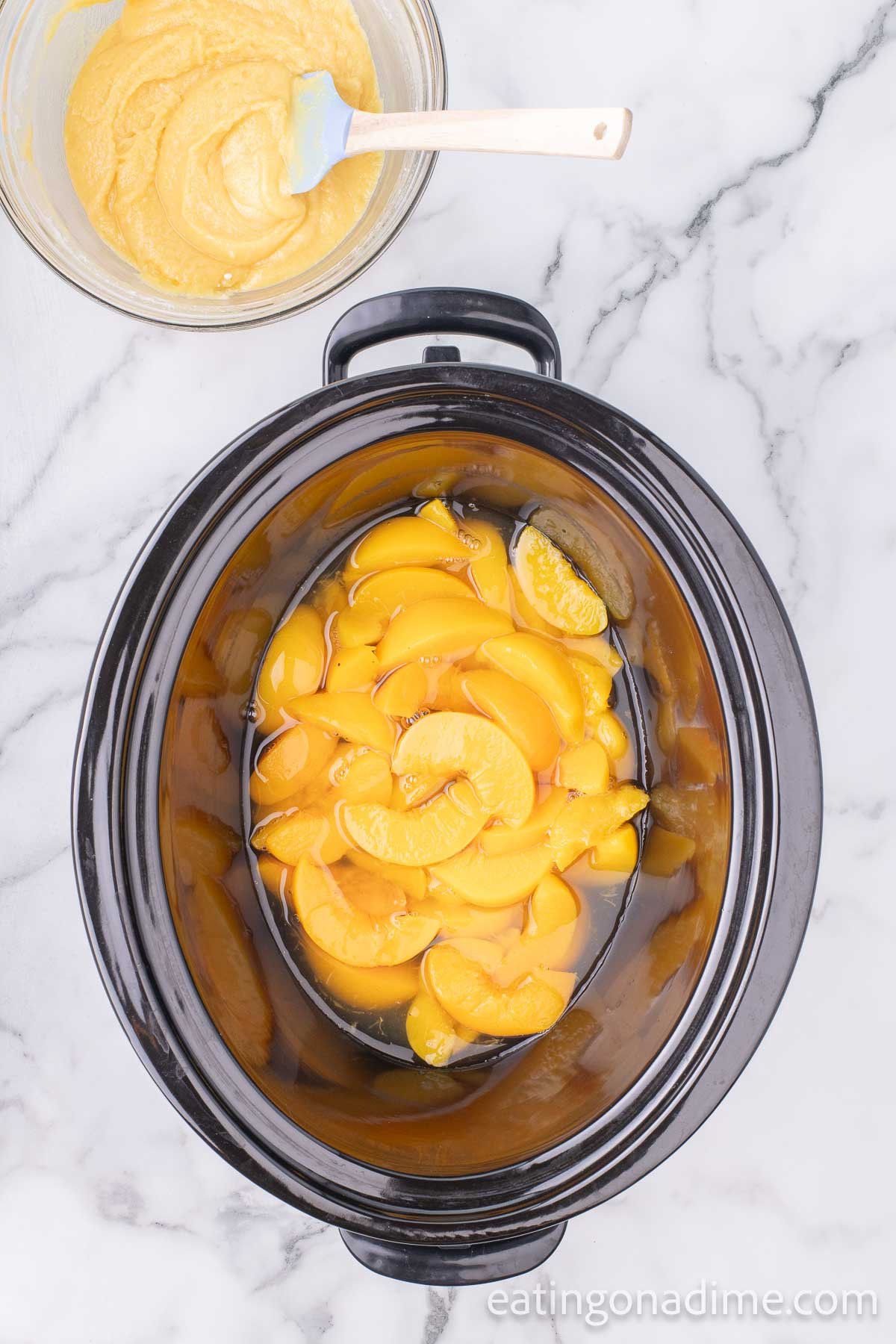 Pouring peaches in the slow cooker