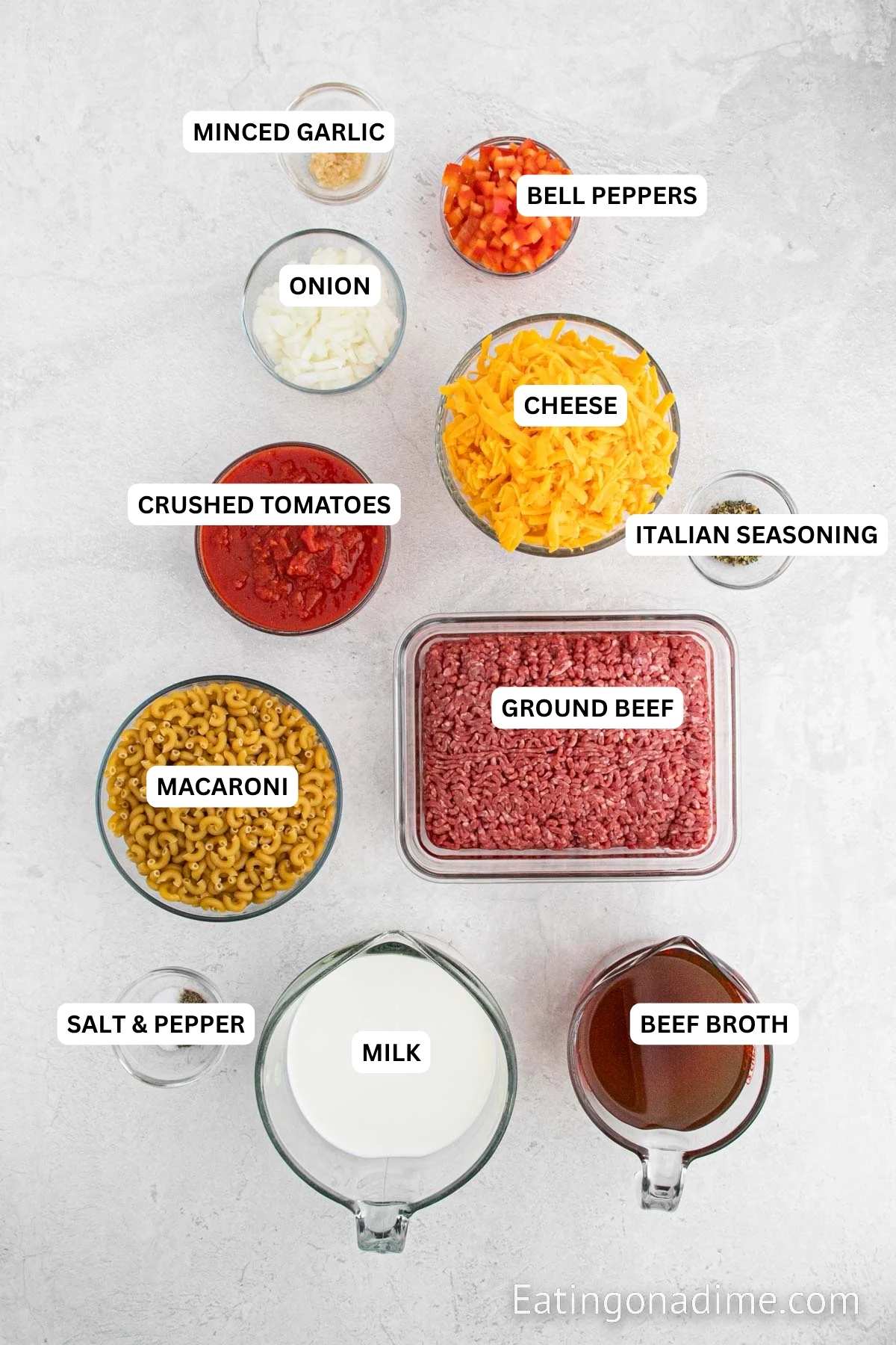 Ingredients for recipe: beef broth, milk, salt, pepper, ground beef, macaroni, crushed tomatoes, Italian seasoning, cheese, onion, bell pepper and minced garlic.