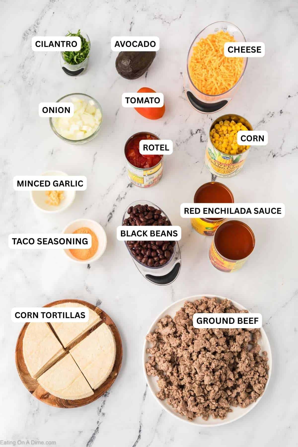 Crock Pot Mexican Casserole Recipe is the perfect meal to feed your family. Each bite is so cheesy and delicious and the entire meal is so easy to prepare. Ingredients for recipe: ground beef, corn tortillas, taco seasoning, black beans, enchilada sauce, taco seasoning, minced garlic, corn, Rotel, onion, tomato and cheese.