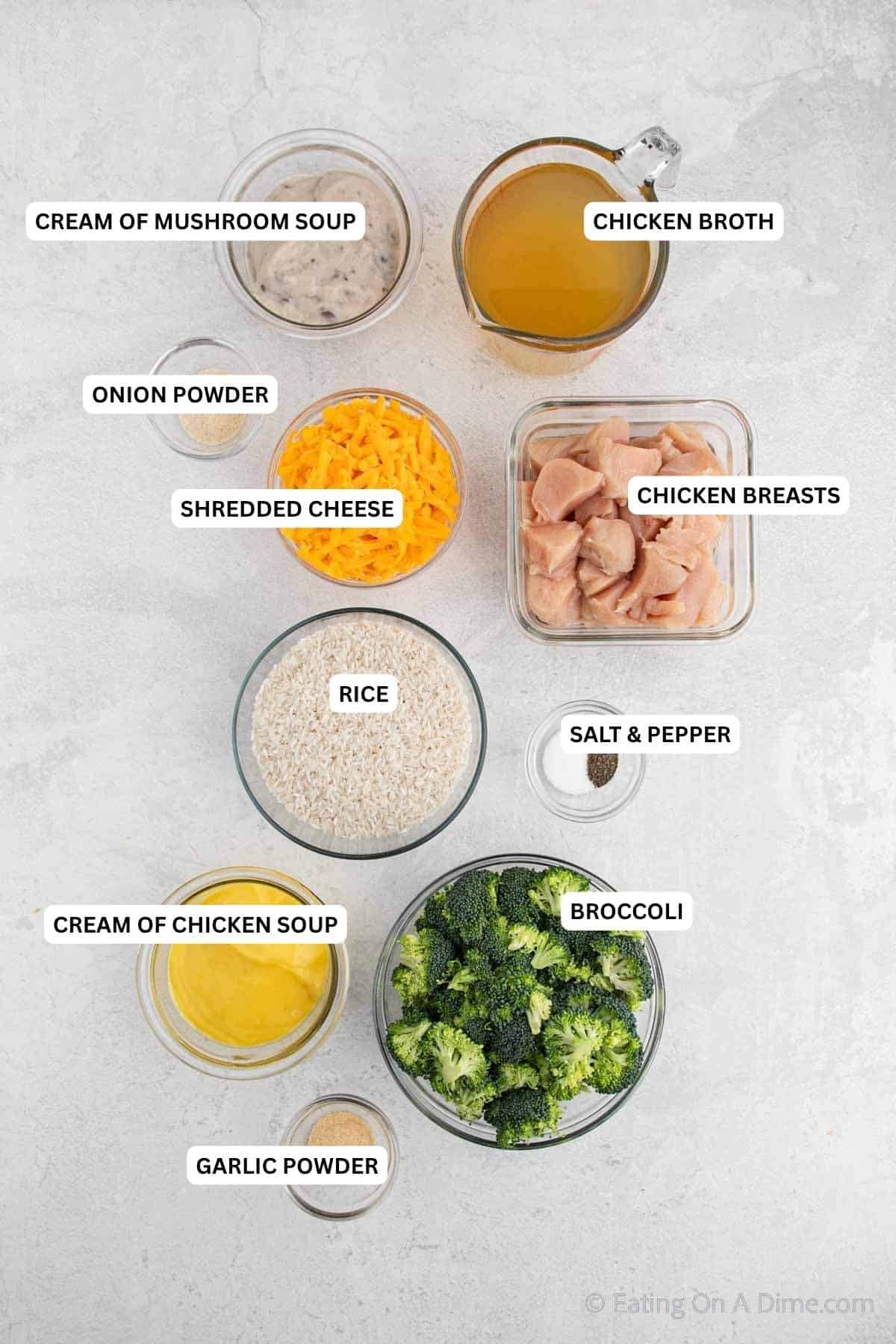 Ingredients for recipe: cream of mushroom soup, chicken broth, onion powder, shredded cheese, chicken breasts, rice, salt, pepper, cream of chicken soup, broccoli and garlic powder.