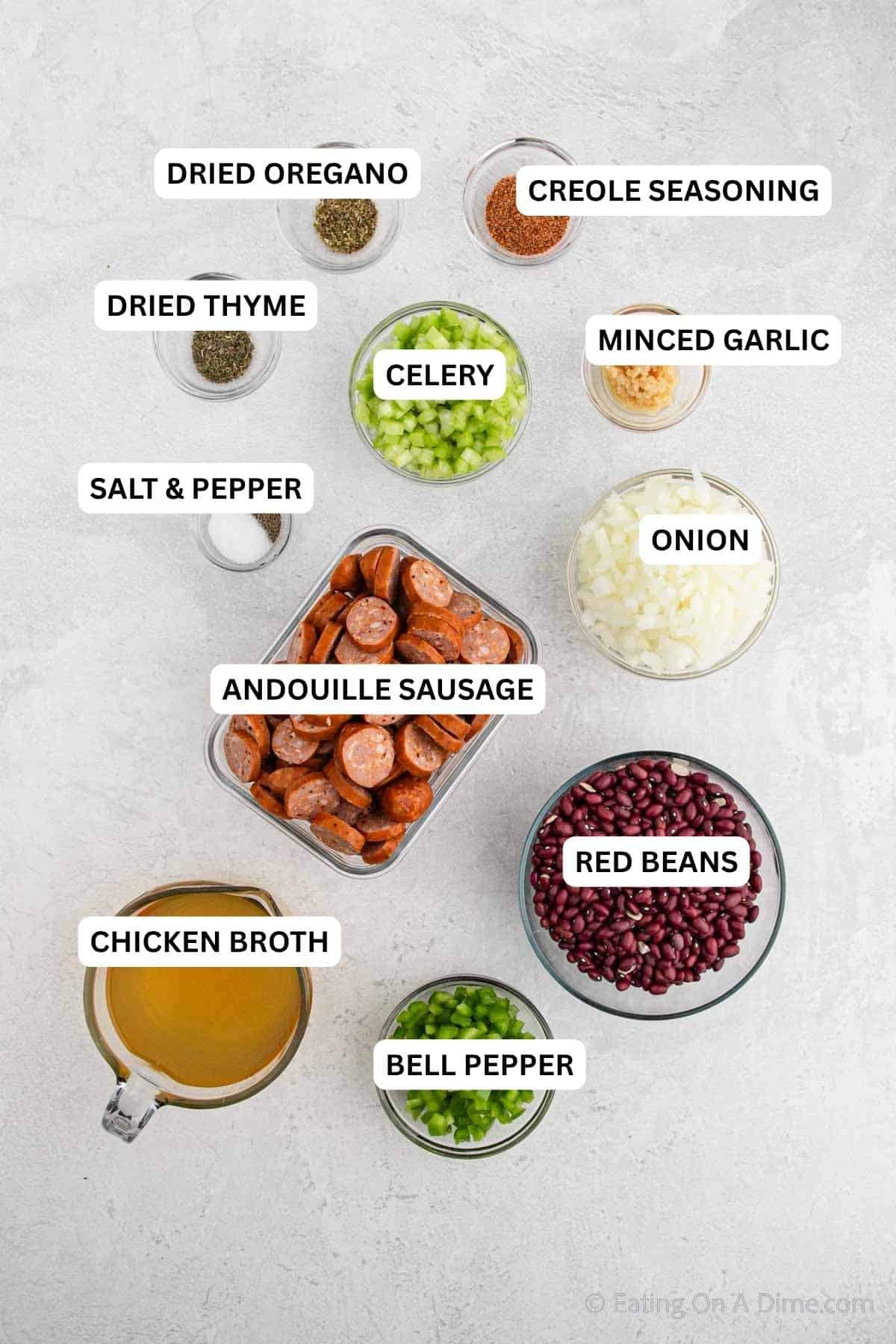 Ingredients for recipe: dried oregano, creole seasoning, dried thyme, salt, pepper, celery, minced garlic, onion, andouille sausage, red beans, chicken broth and bell pepper. 