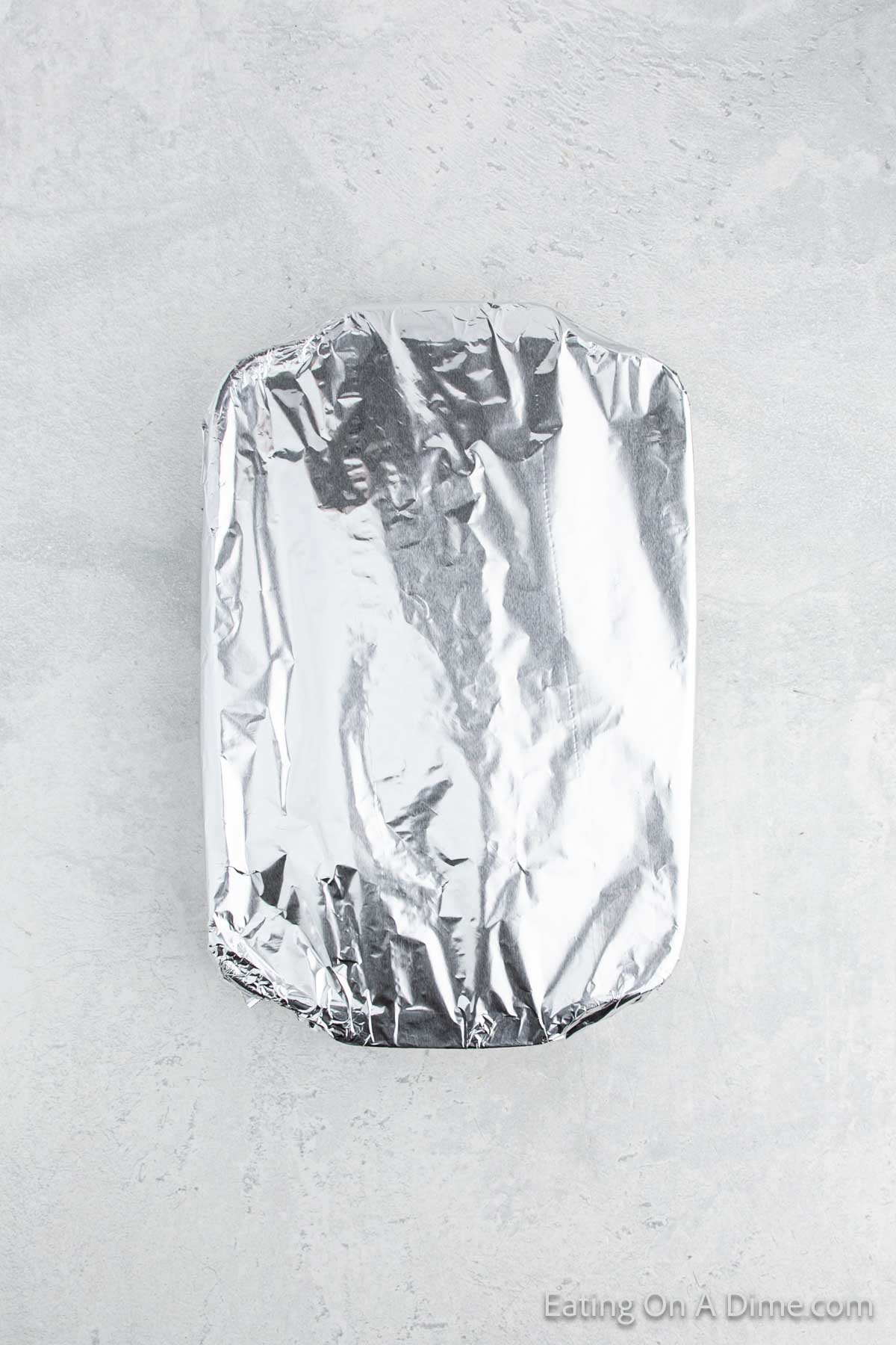 The casserole covered with foil and ready to bake.  