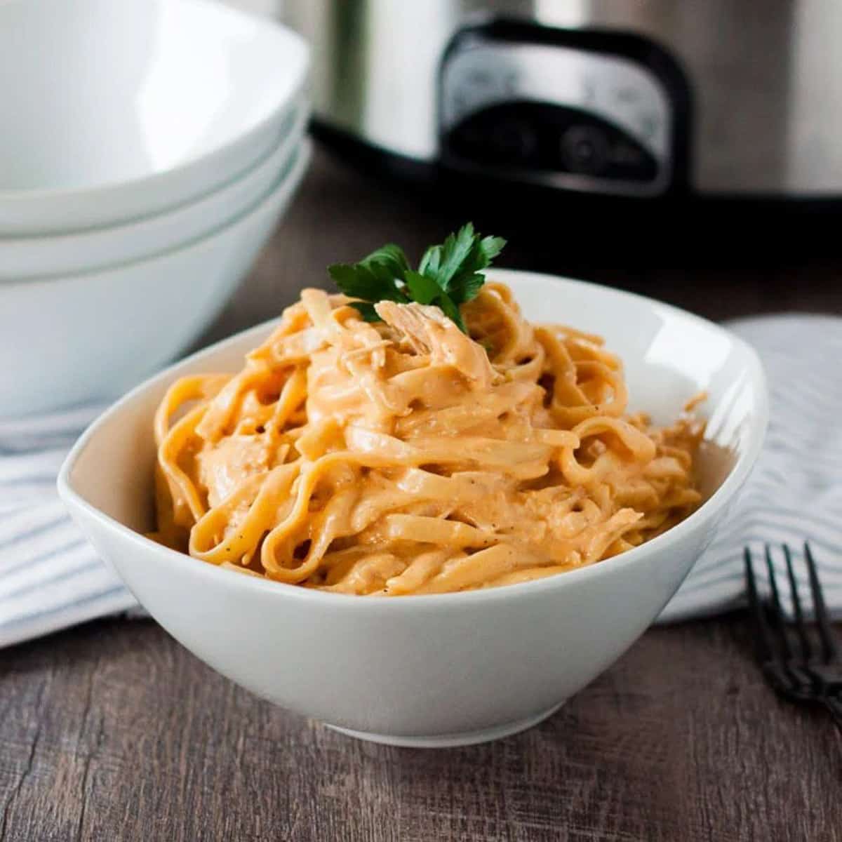 Creamy Buffalo Chicken pasta in a white bowl.