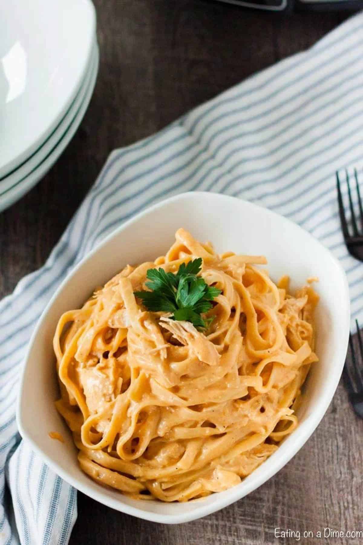 Creamy Buffalo Chicken pasta in a white bowl. 