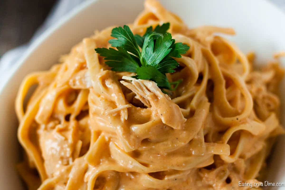 Creamy Buffalo Chicken pasta in a white bowl. 