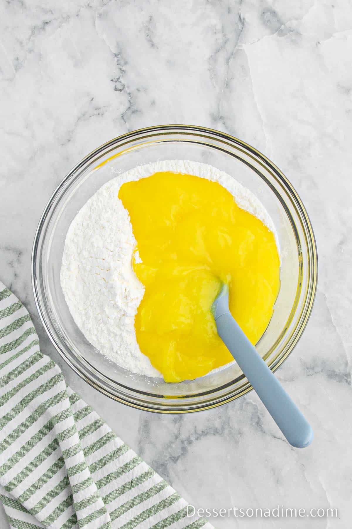 Combining the angel food cake with the lemon pie filling