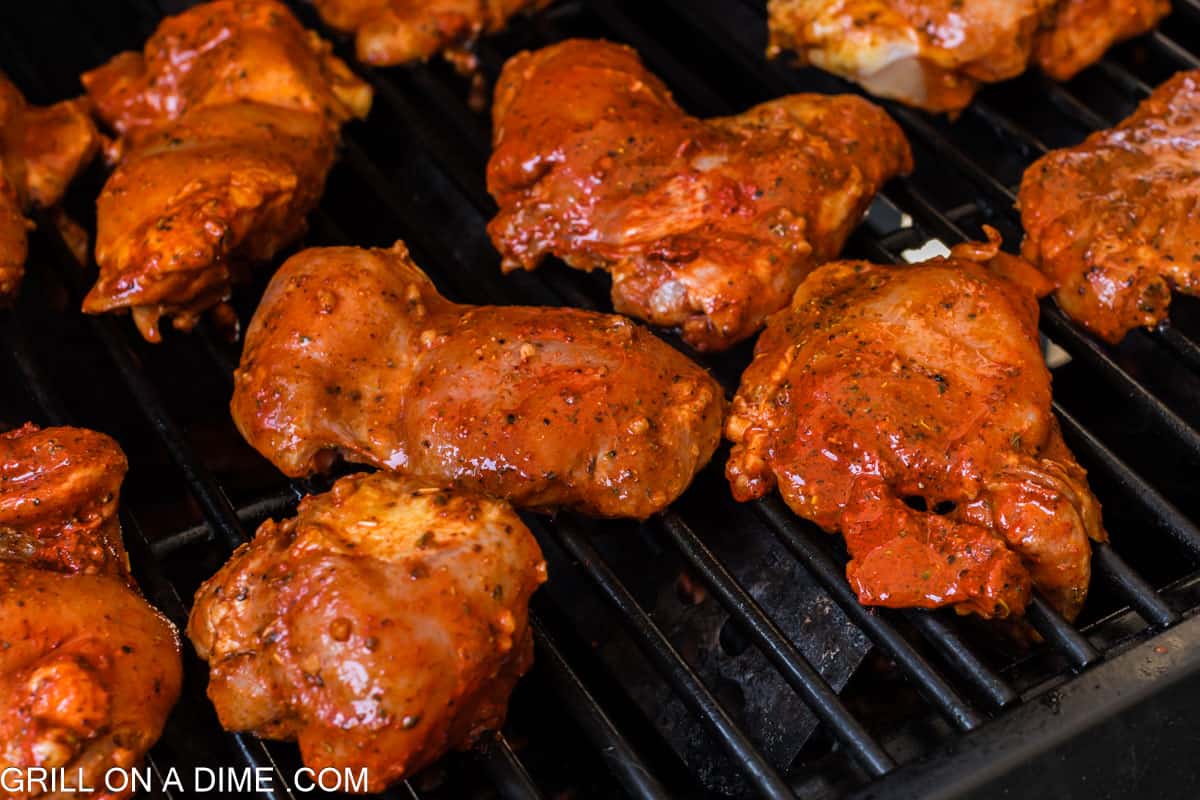 Placing the marinated chicken on the grill