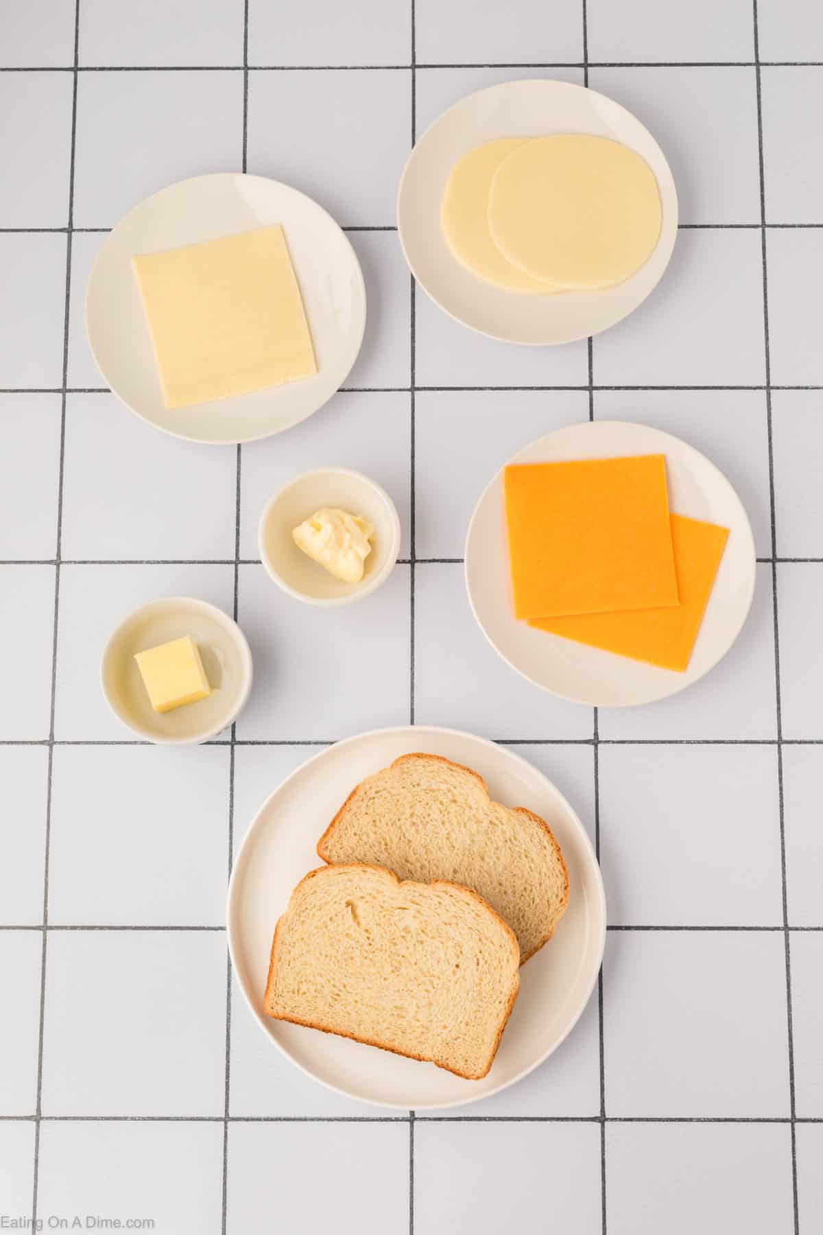 Grilled Cheese Sandwich ingredients - sourdough bread, butter, mayonnaise, cheddar cheese, provolone cheese, mozzarella cheese