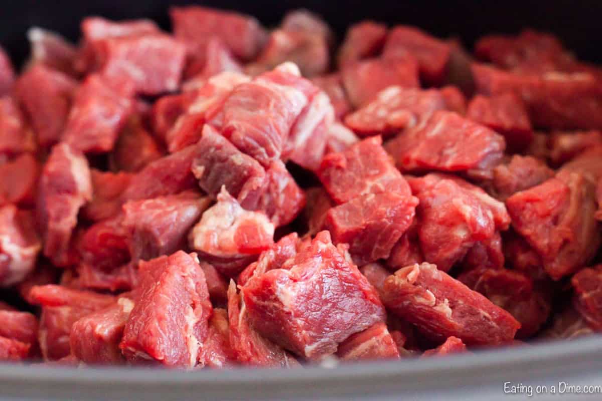 Diced beef placed in the slow cooker