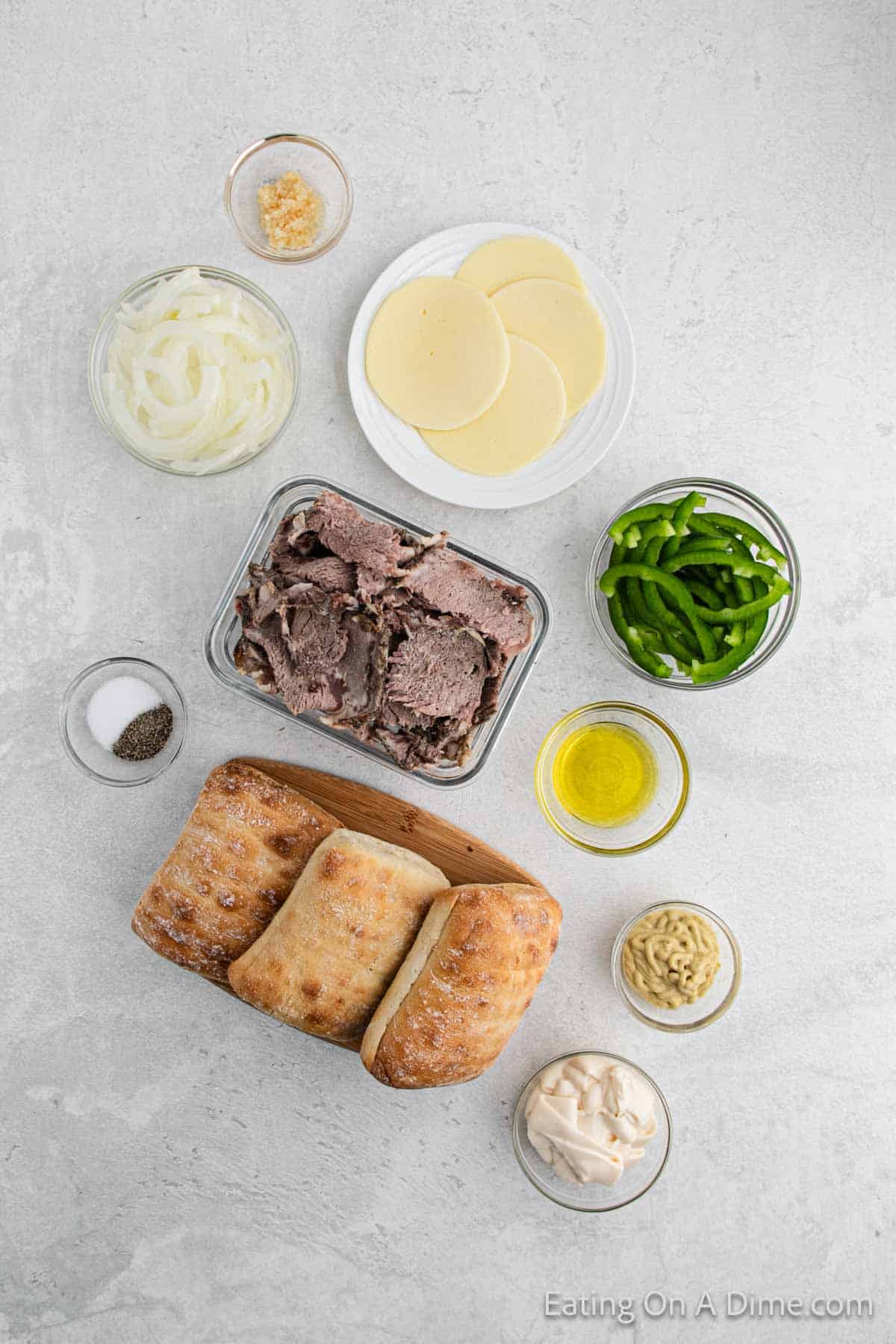 Prime Rib Sandwiches Ingredients - mayonnaise, dijon mustard, garlic, olive oil, onion, green bell pepper, prime rib, salt, pepper, bread, provolone cheese