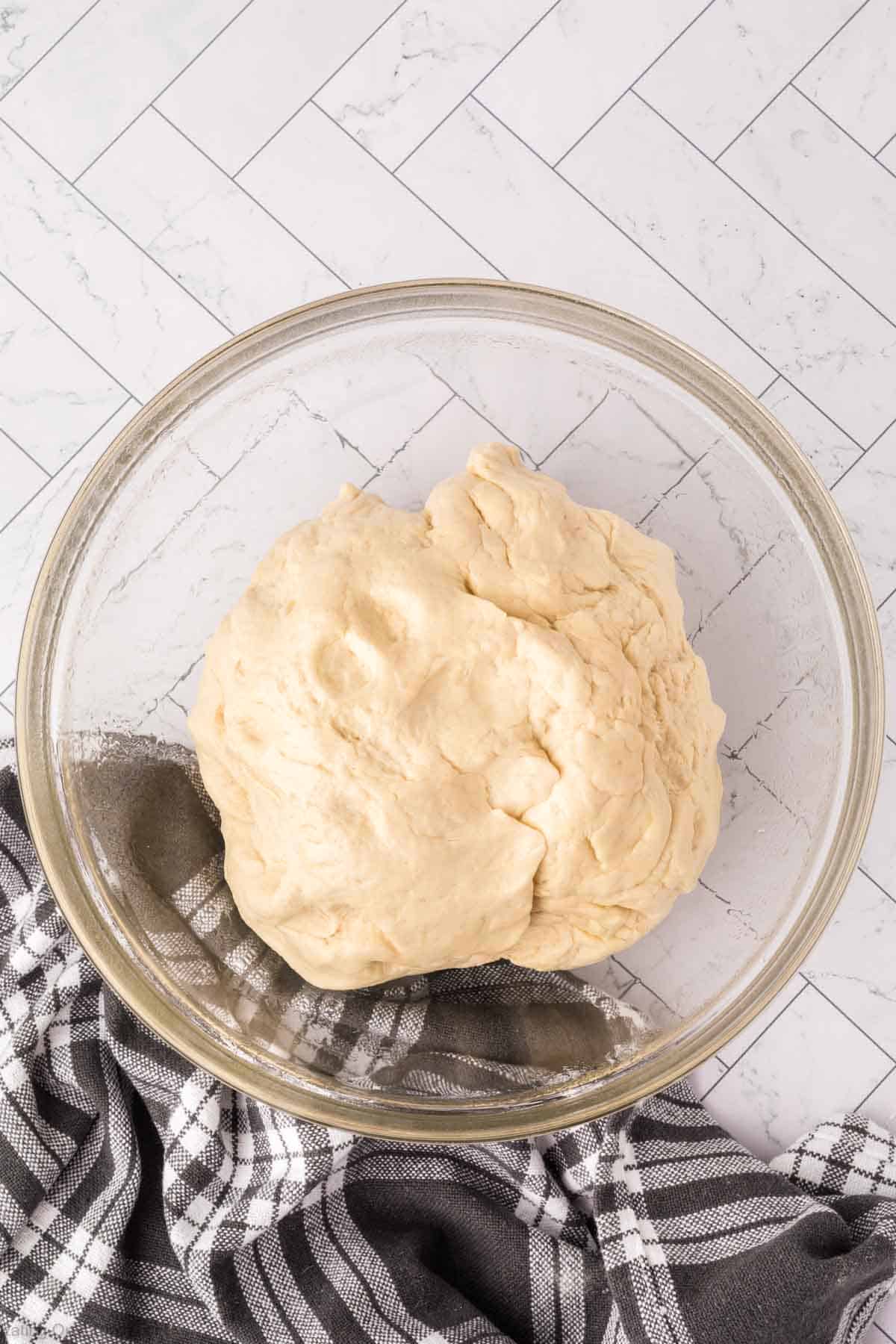 Kneading dough in a bowl