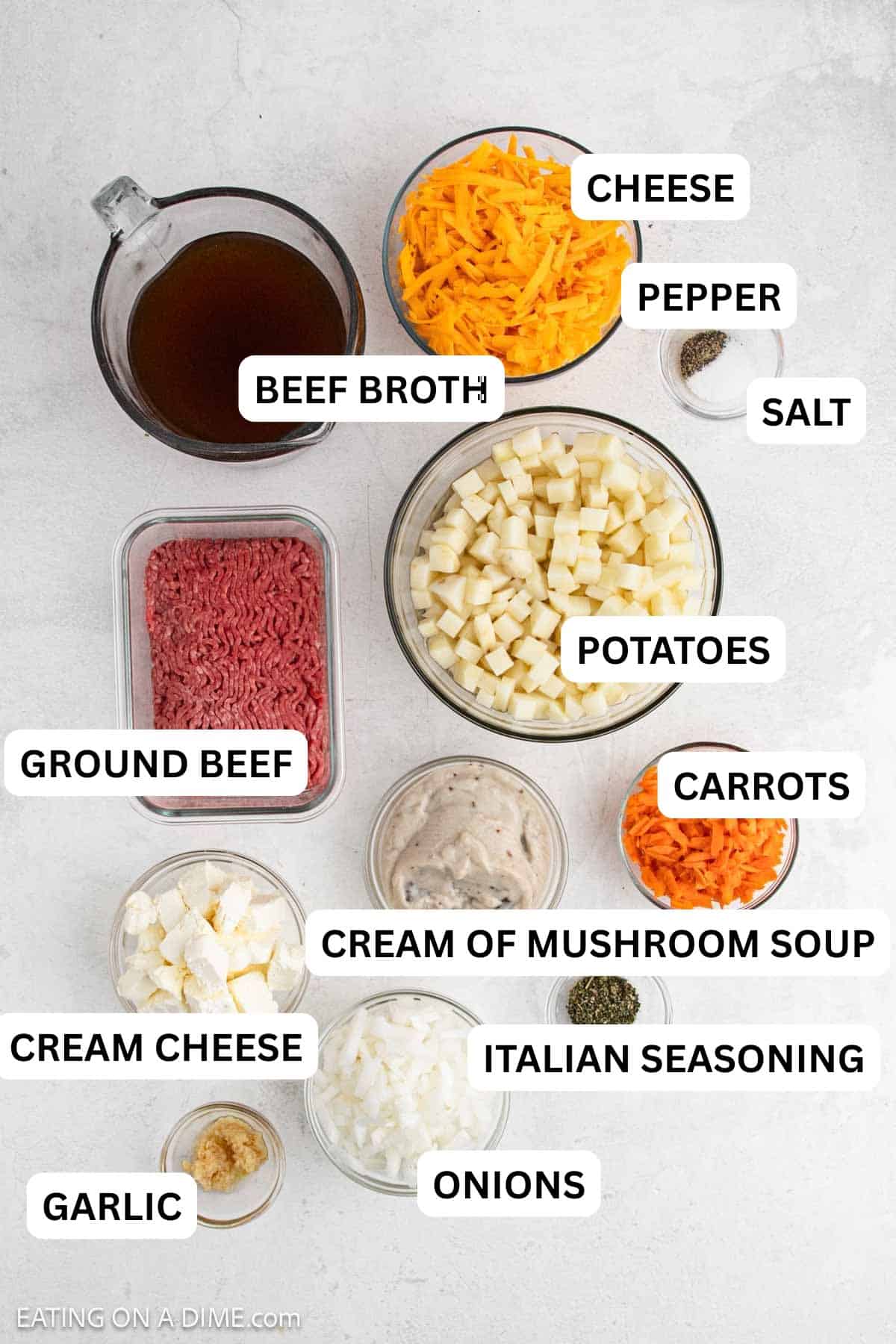 Ingredients needed for this recipe includes broth, cheese, ground beef, diced potatoes, salt, pepper, shredded carrots, cream of mushrooms oup, cream cheese, onions, and spices.
