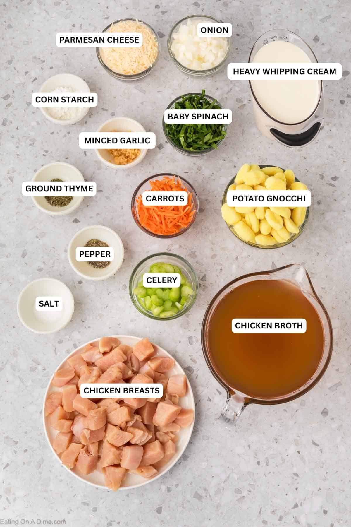Ingredients for recipe: chicken breasts, chicken broth, salt, pepper, celery, carrots, potato gnocchi, ground thyme, minced garlic, spinach, corn starch, heavy cream, onion and parmesan cheese.
