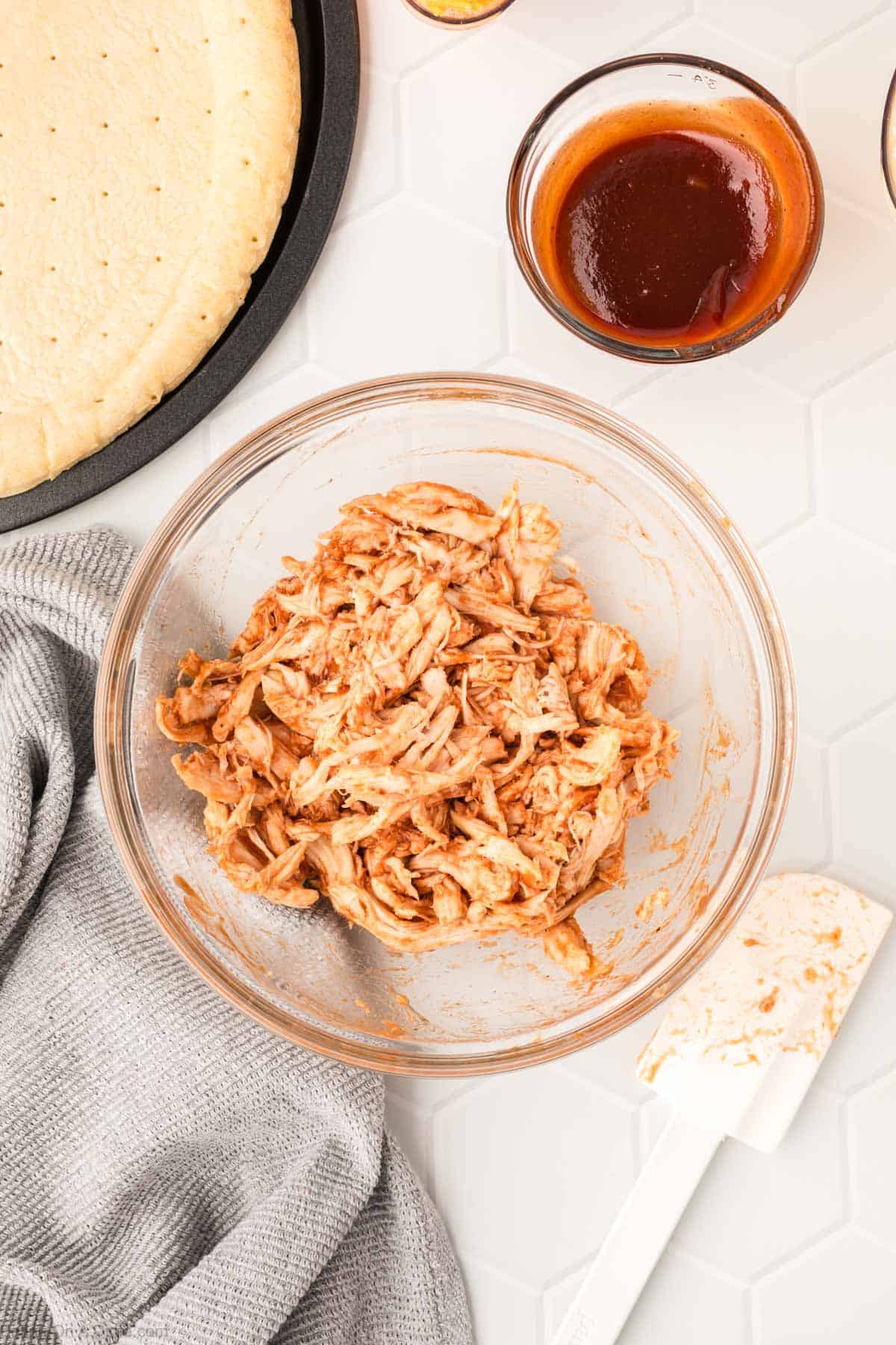 Shredded Chicken mixed with BBQ Sauce in a bowl