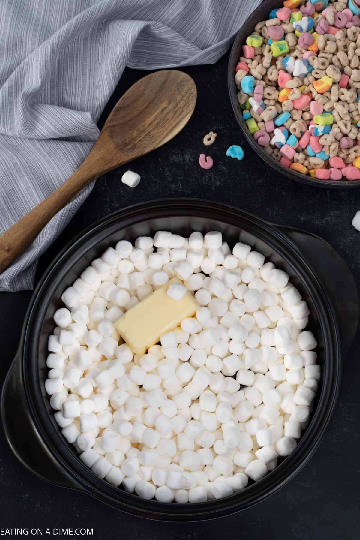 Stick of butter in a large pot with marshmallows