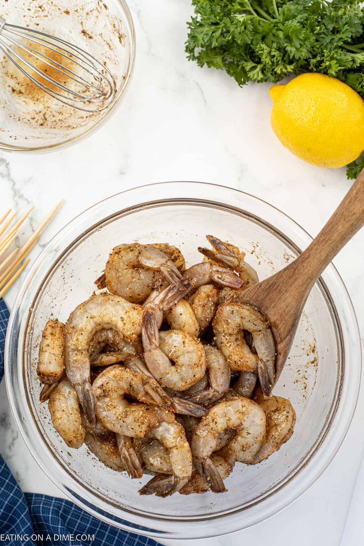 Combine the ingredients with the shrimp in a bowl with a wooden spoon