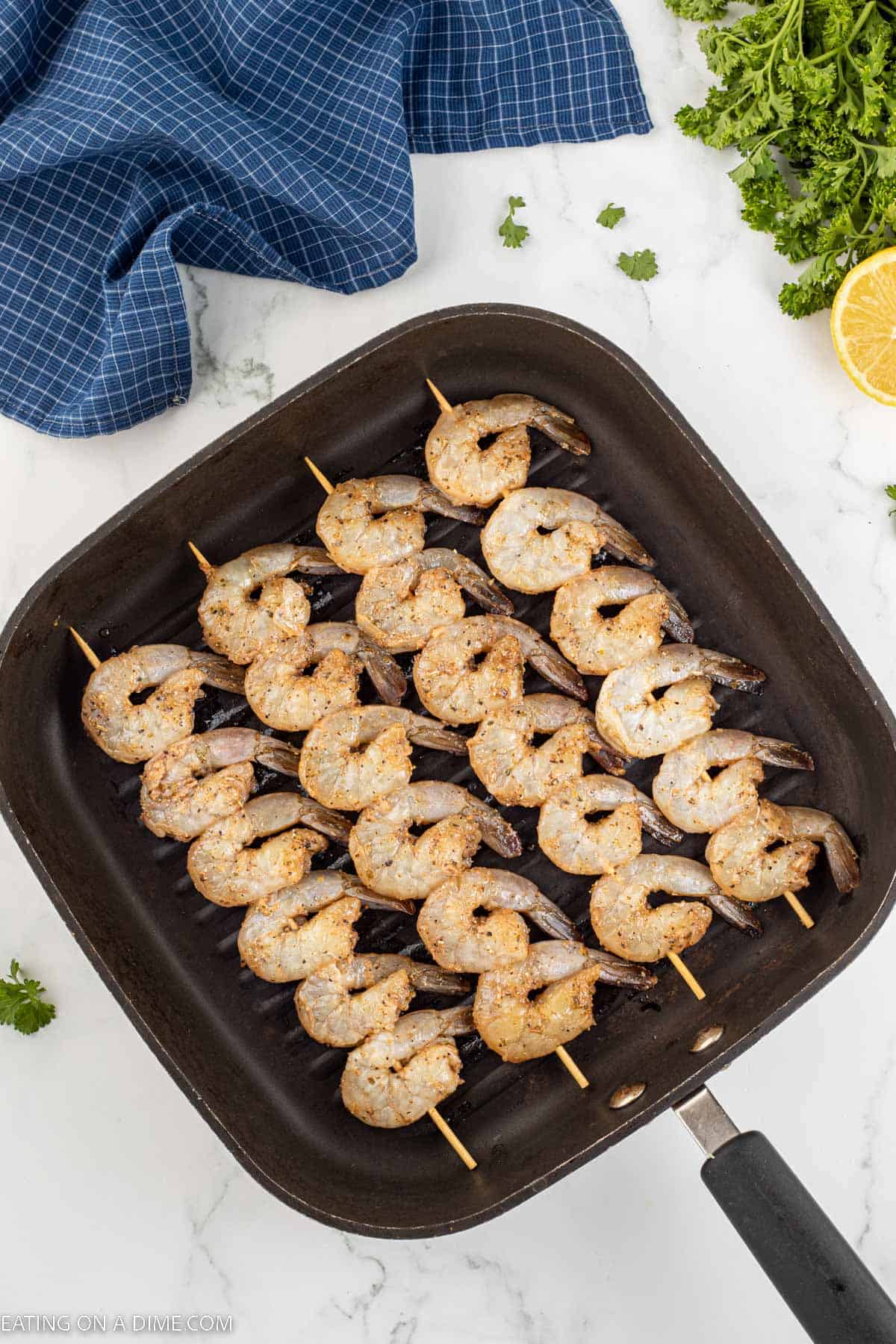 Shrimp Skewers cooking in a skillet
