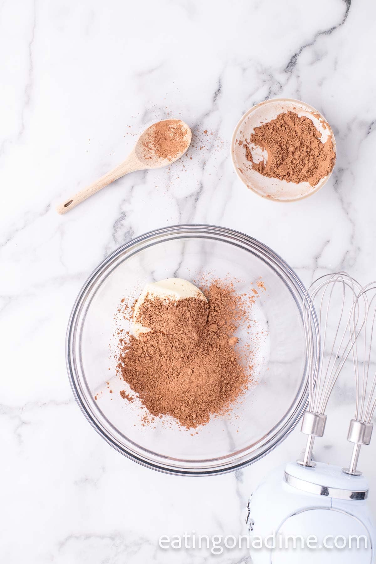 Combining the butter and cocoa powder together in a bowl
