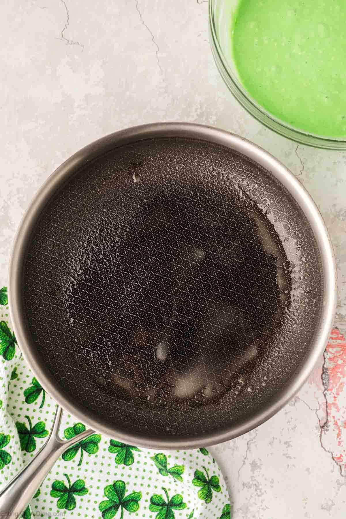 Heating a skillet with butter