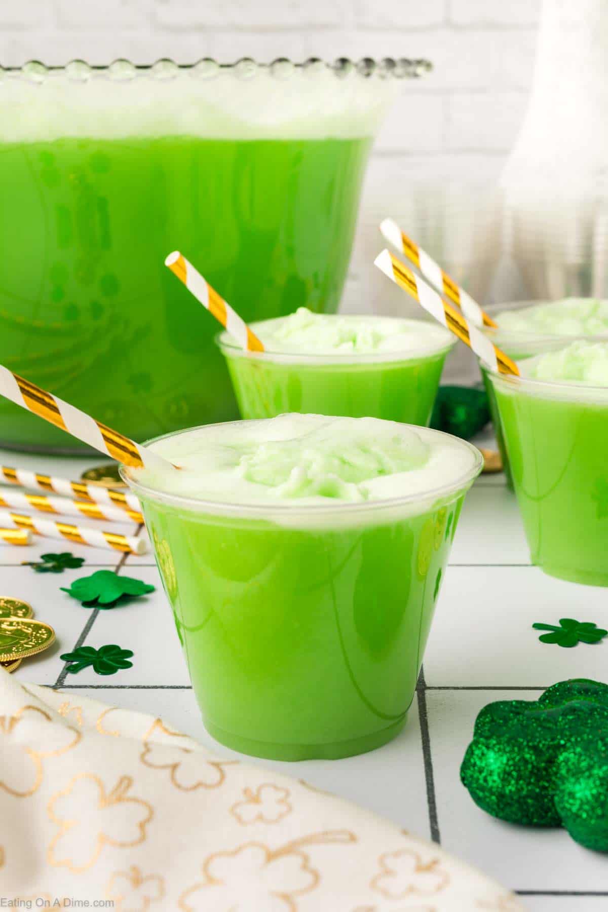Green Punch in cups with straws