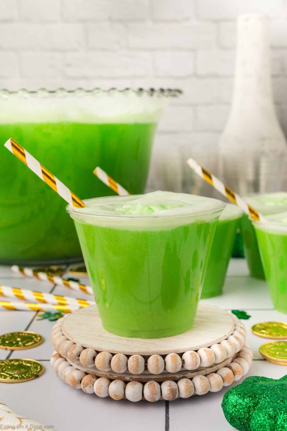 Green Punch in cups with straws