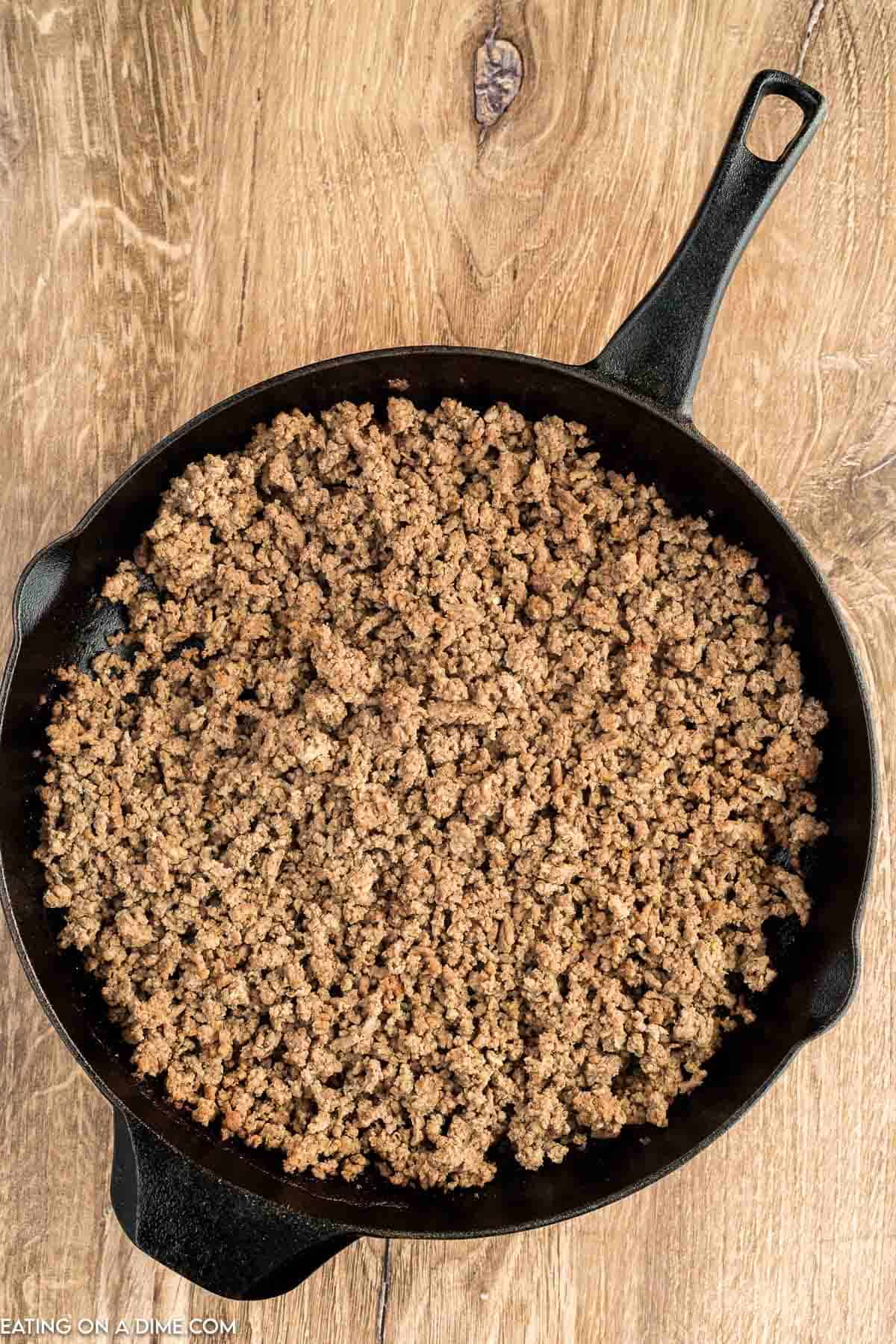 Cooked ground beef in a cast iron skillet