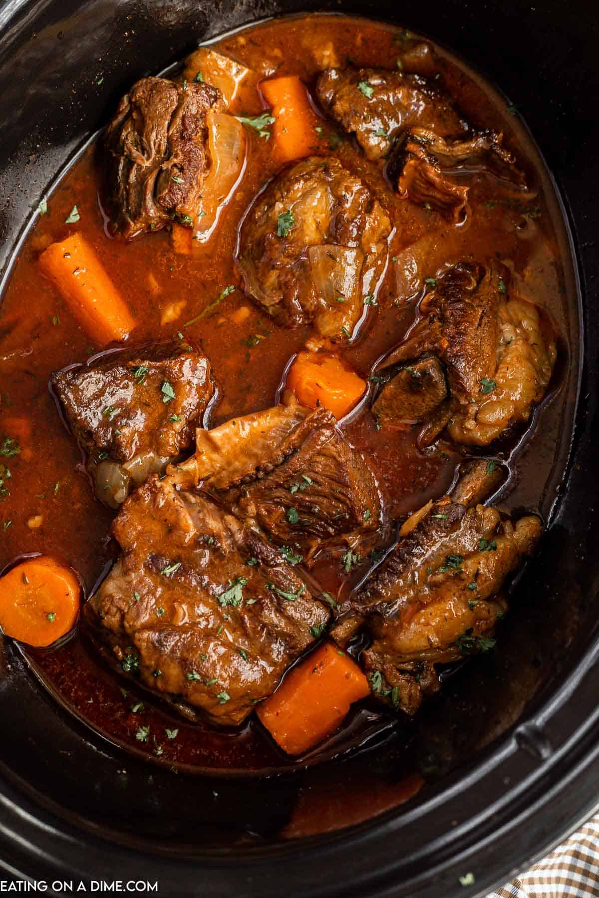 short ribs and carrots in the slow cooker cooked
