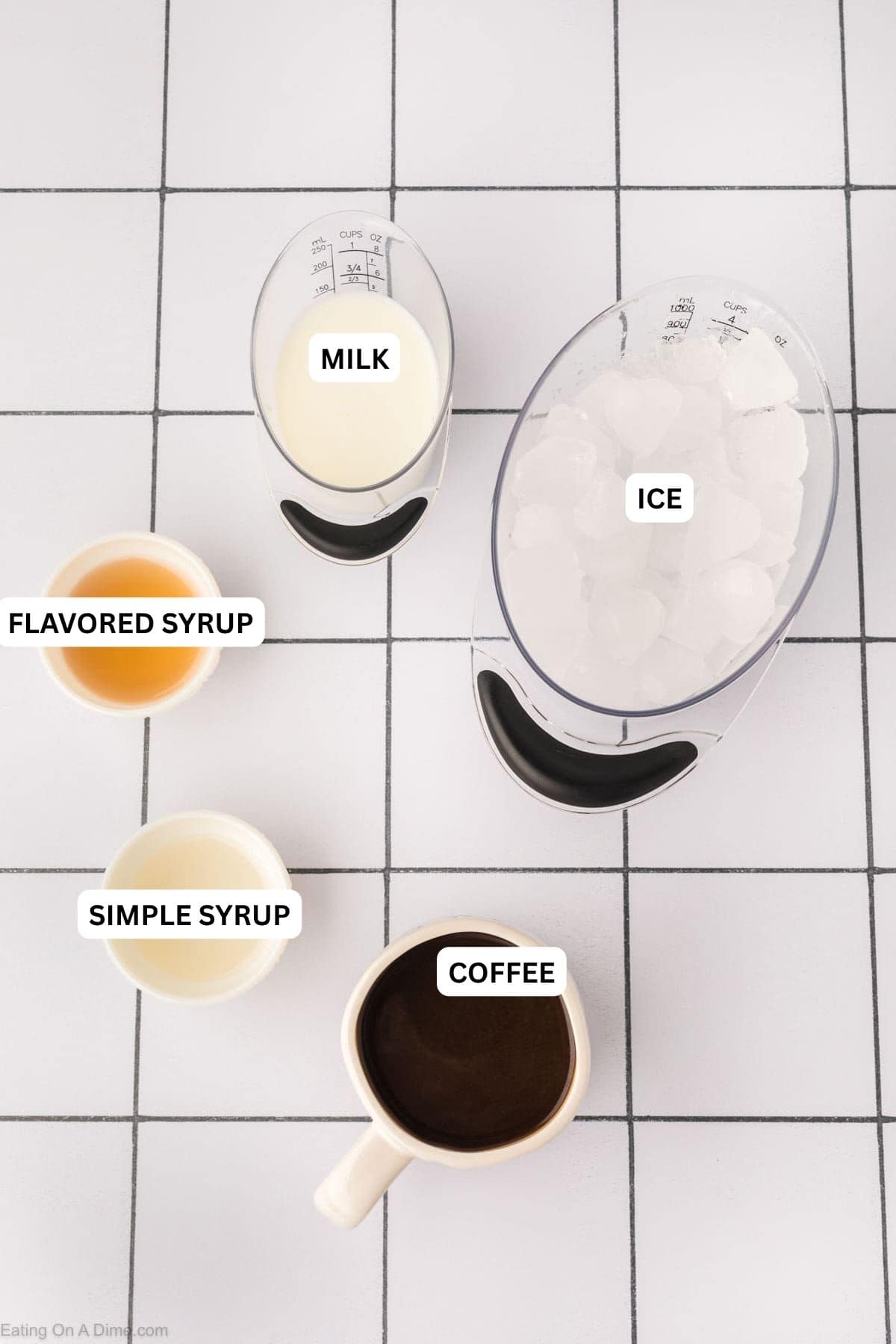Ingredients for recipe: milk, ice, flavored syrup, simple syrup and coffee.