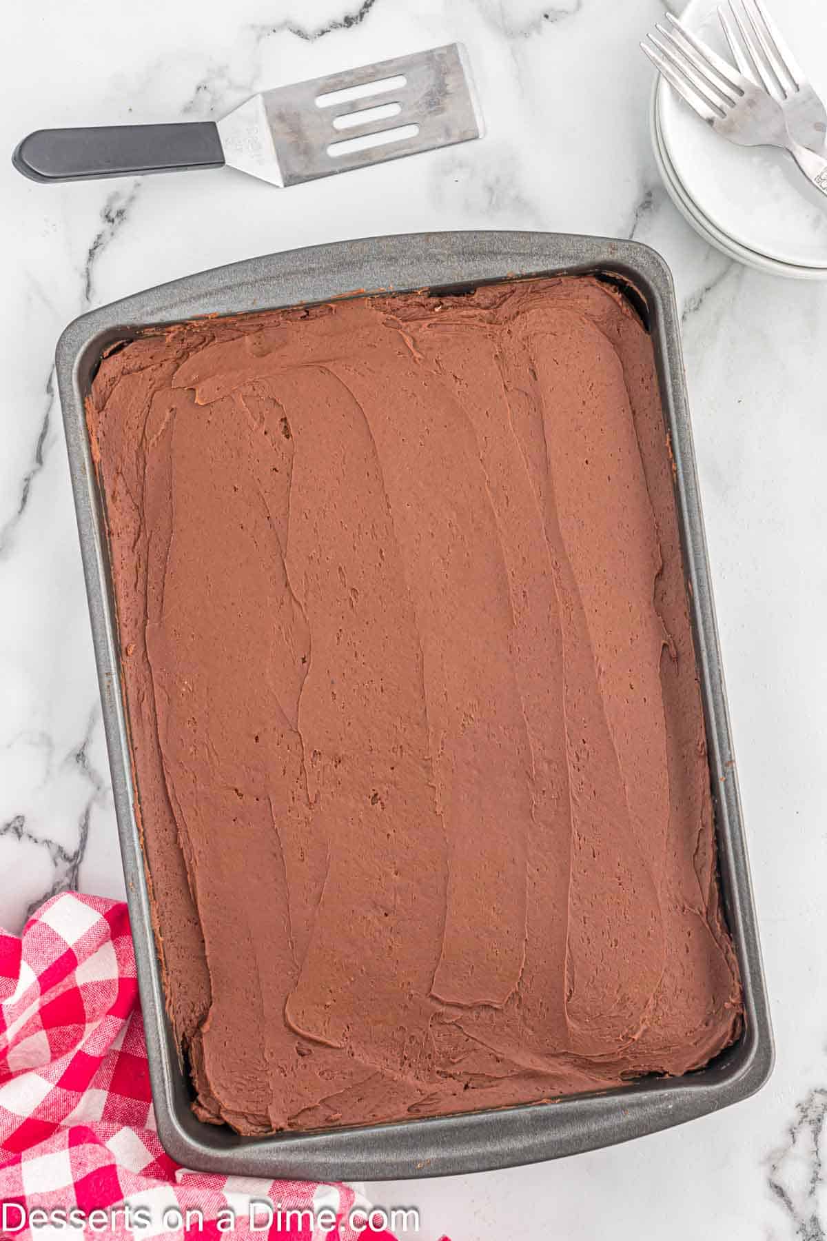 Frosted cake in a baking pan