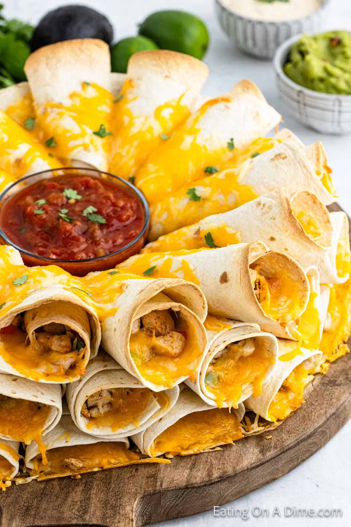 Blooming Quesadilla on a platter with a bowl of salsa in the center of the quesadilla ring.