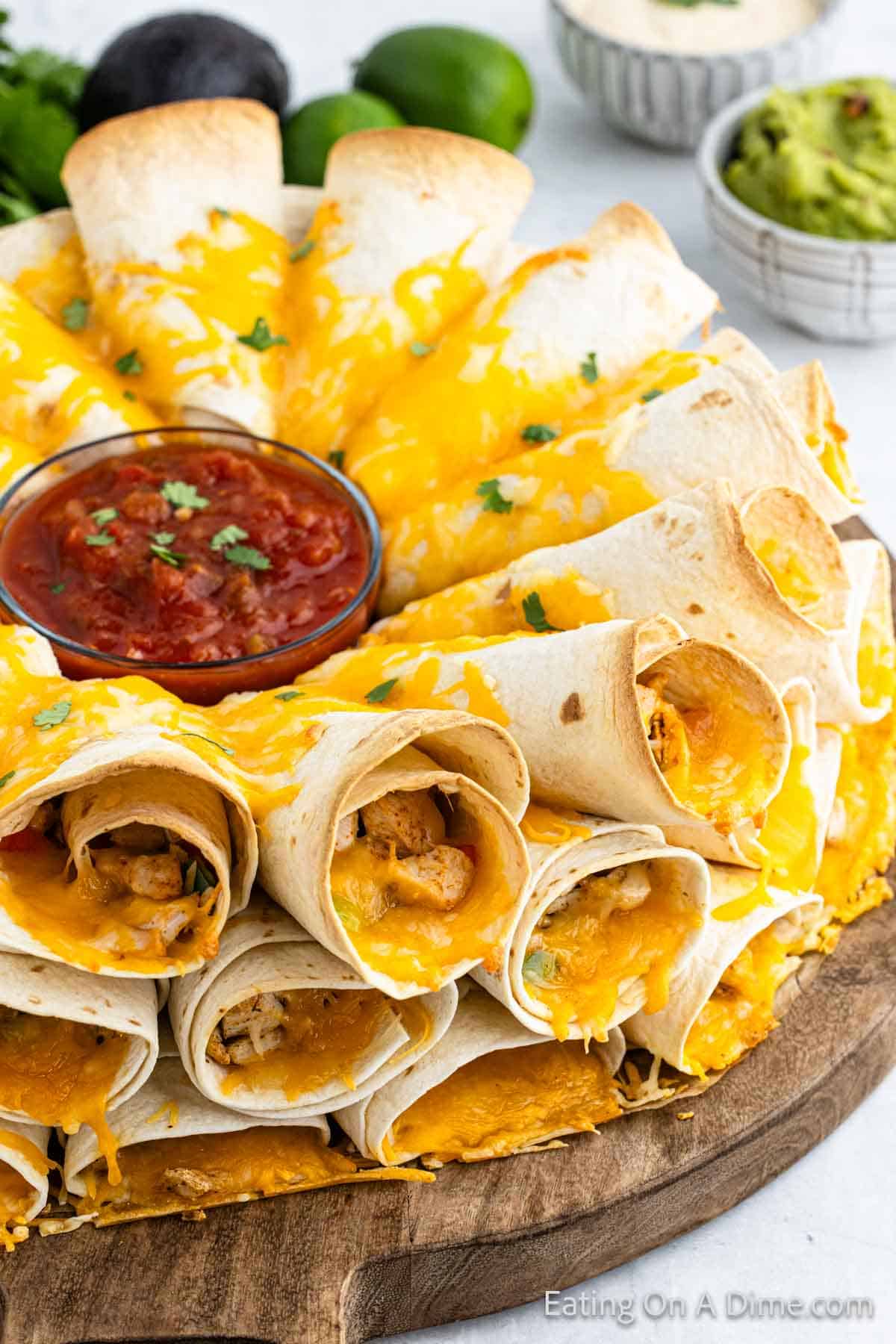 Blooming Quesadilla on a platter with a bowl of salsa in the center of the quesadilla ring. 