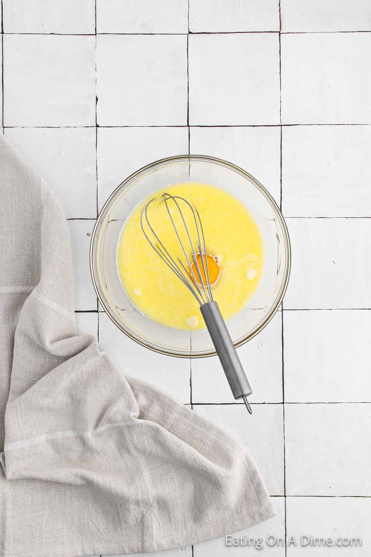 Whisking butter, egg and milk in a bowl