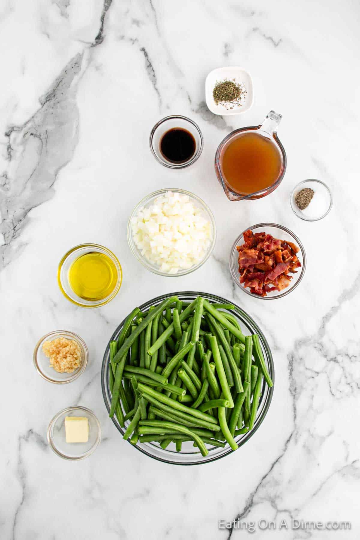 Fresh green beans, butter, garlic, oil, chopped onions, chopped bacon, salt, pepper, broth, seasoning