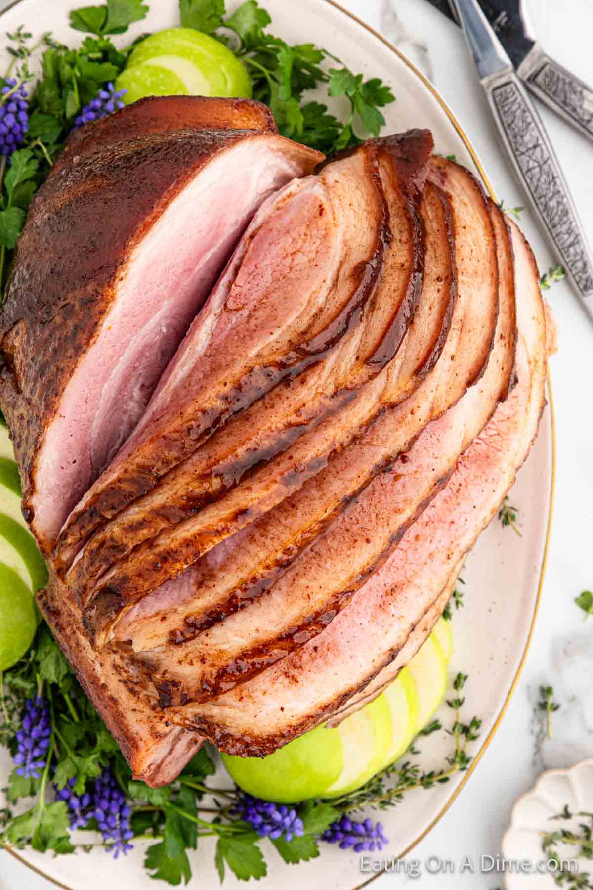 Slice ham topped with glaze on a platter
