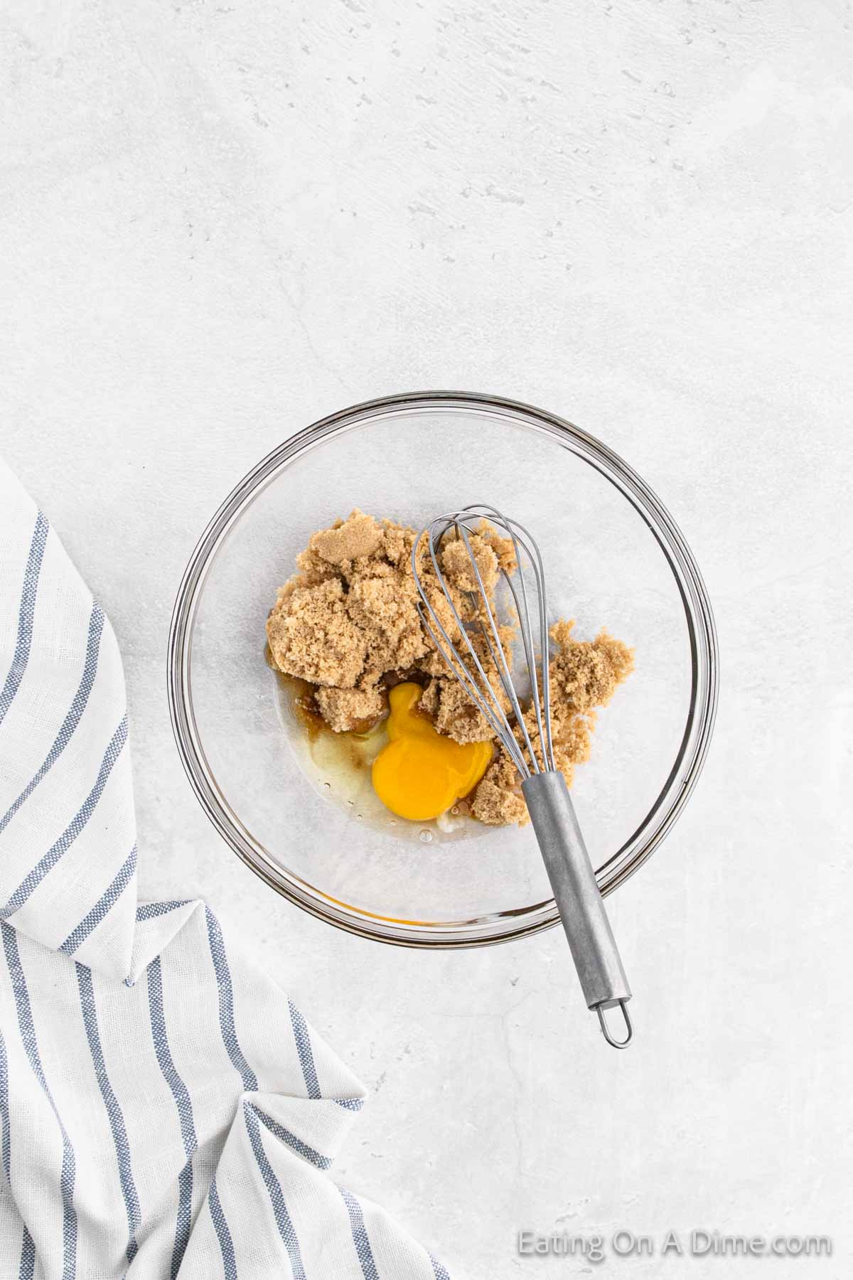 Whisk together eggs and brown sugar together in a bowl