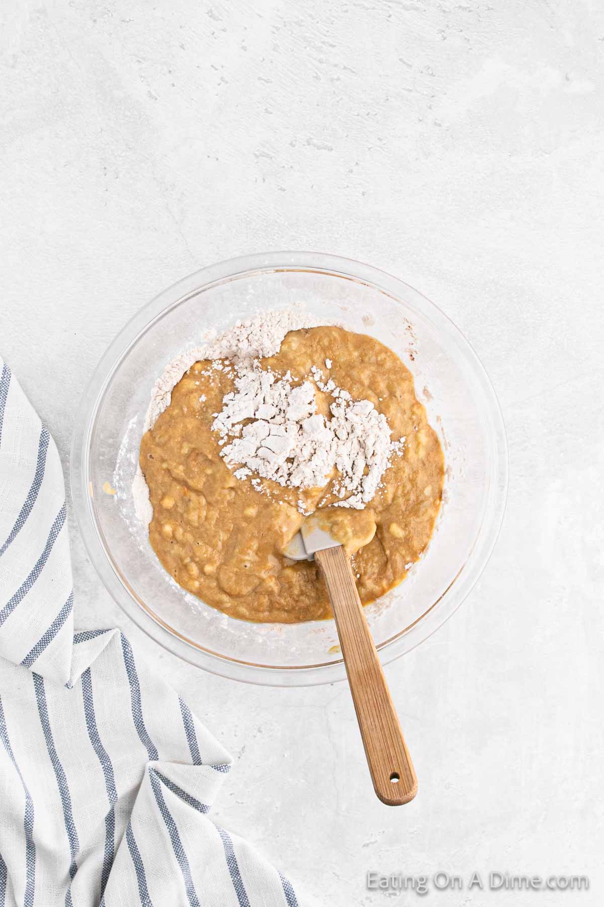 Mix in the dry ingredients to the banana mixture in a spatula