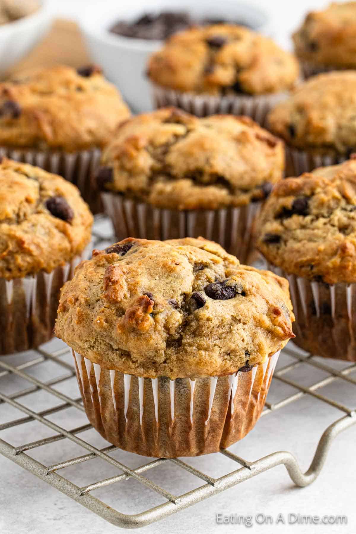 Peanut butter banana muffins stacked on a wire rack