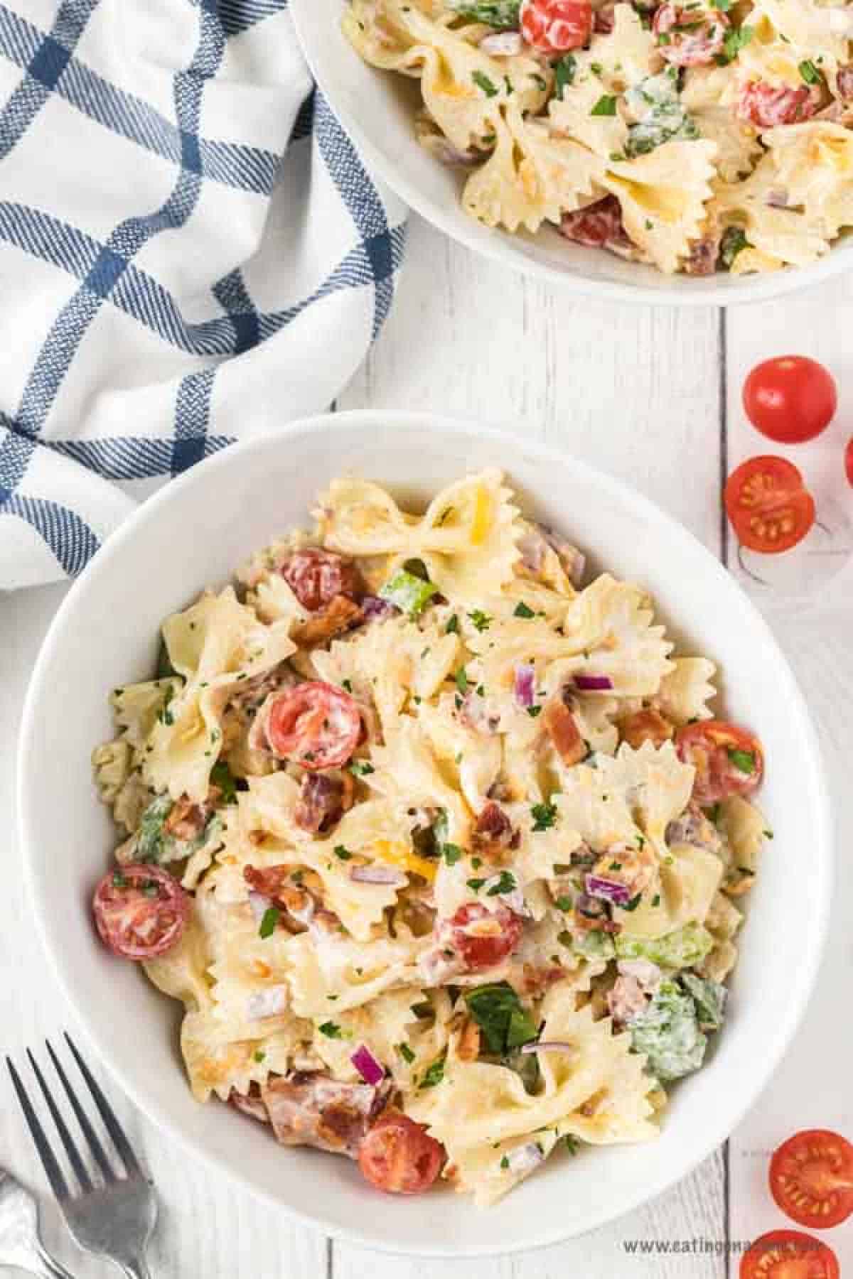 BLT Pasta Salad is always a crowd pleaser. There is something about that creamy ranch dressing combined with the bacon and veggies that make this delicious. BLT Pasta Salad in a bowl