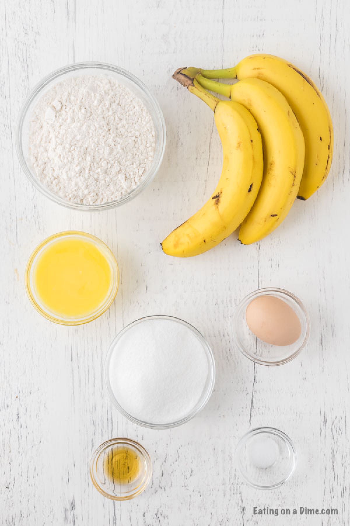 Banana Bread ingredients - bananas, flour, butter, egg, sugar, vanilla