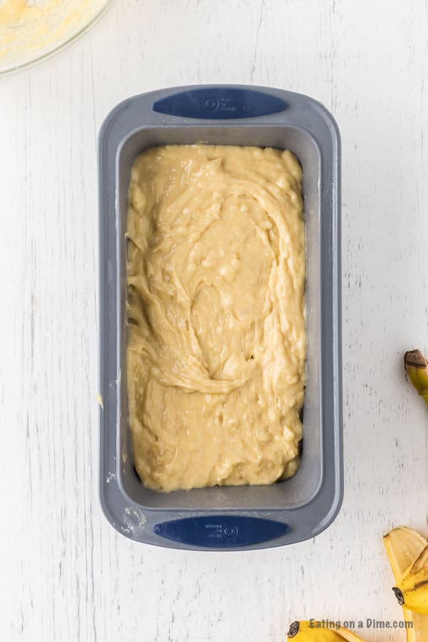 Banana Bread batter spread into the loaf pan