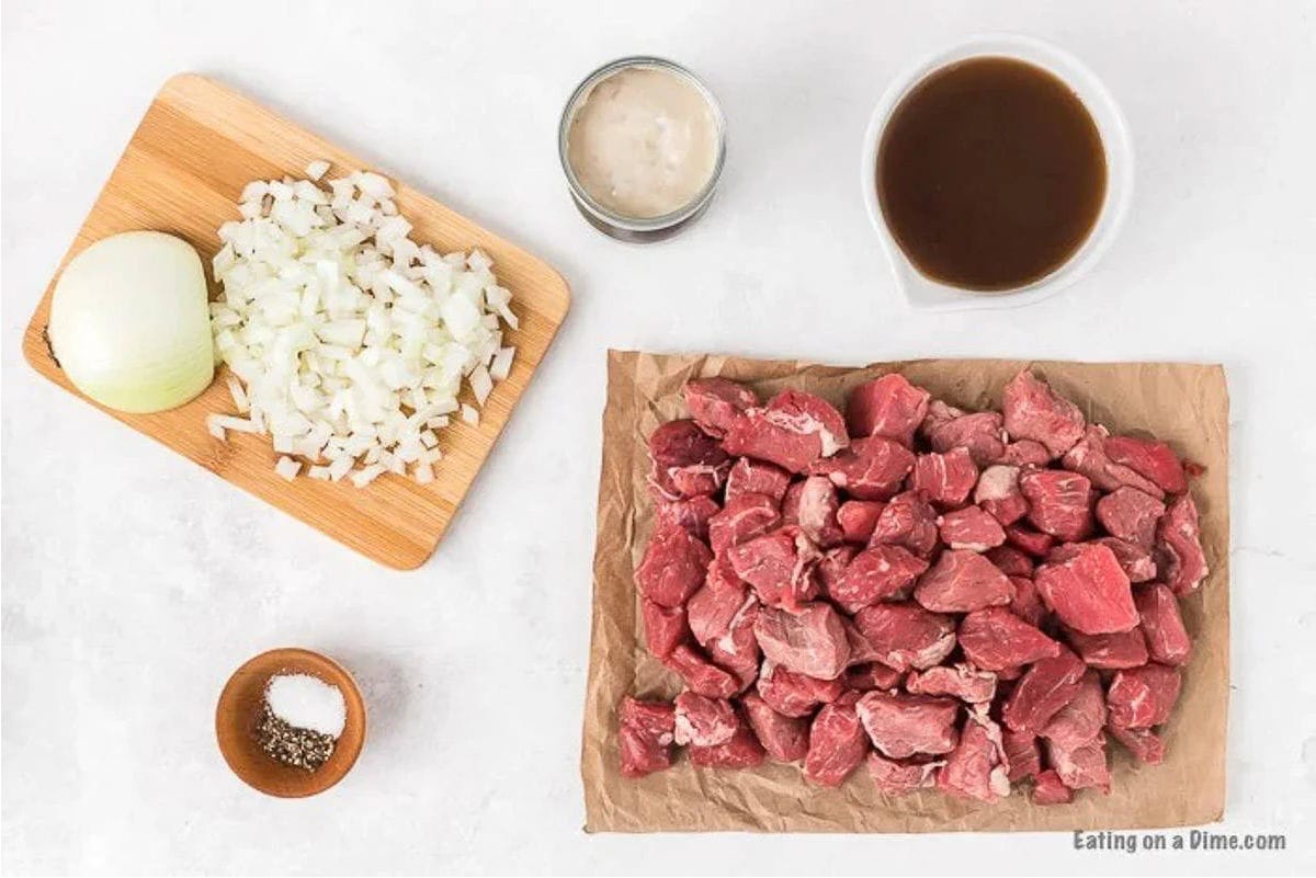 Beef Tips ingredients - Cream of mushroom soup, onion, beef broth, salt and pepper, stew meat