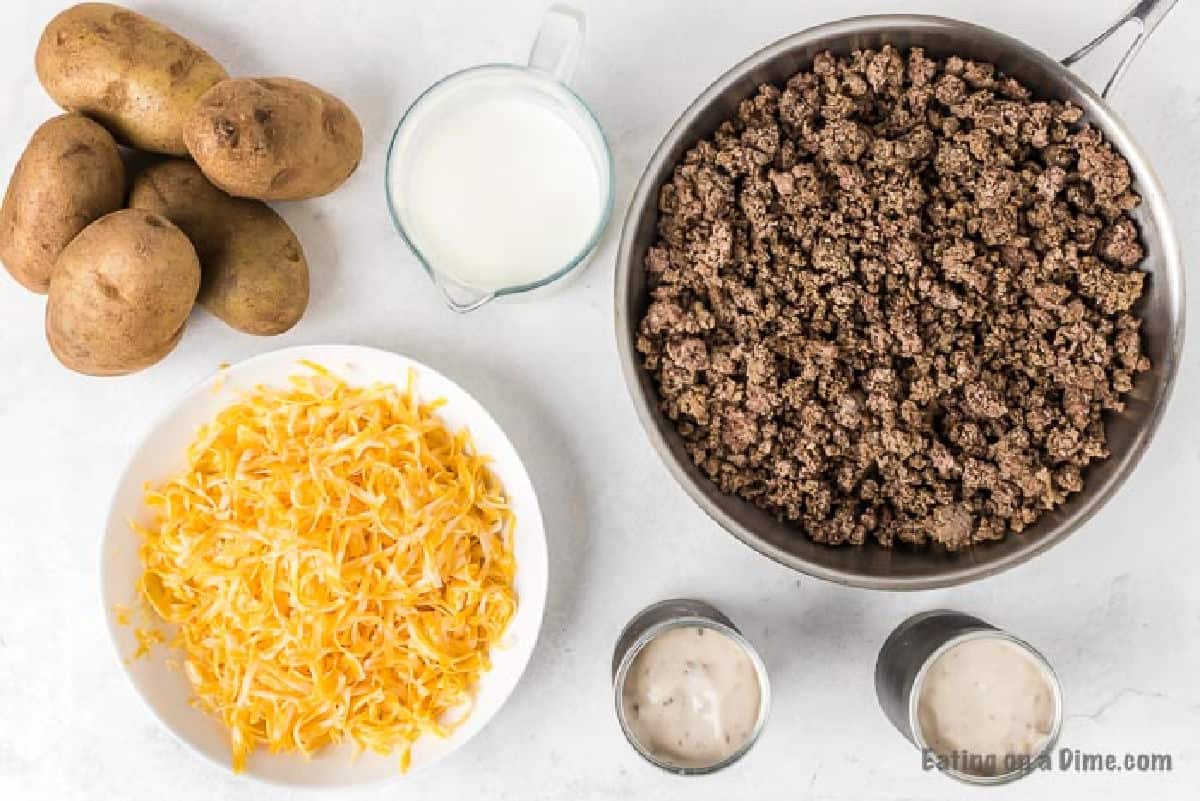 Hamburger Casserole ingredients - potatoes, ground beef, cream of mushroom soup, milk, cheese