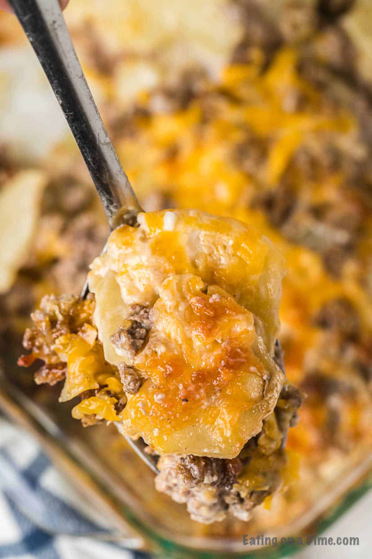 Hamburger Casserole in a baking dish with a serving on a spoon