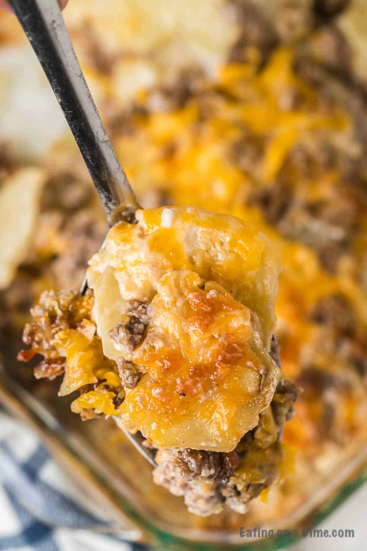 Close up image of hamburger casserole with a serving on a spoon