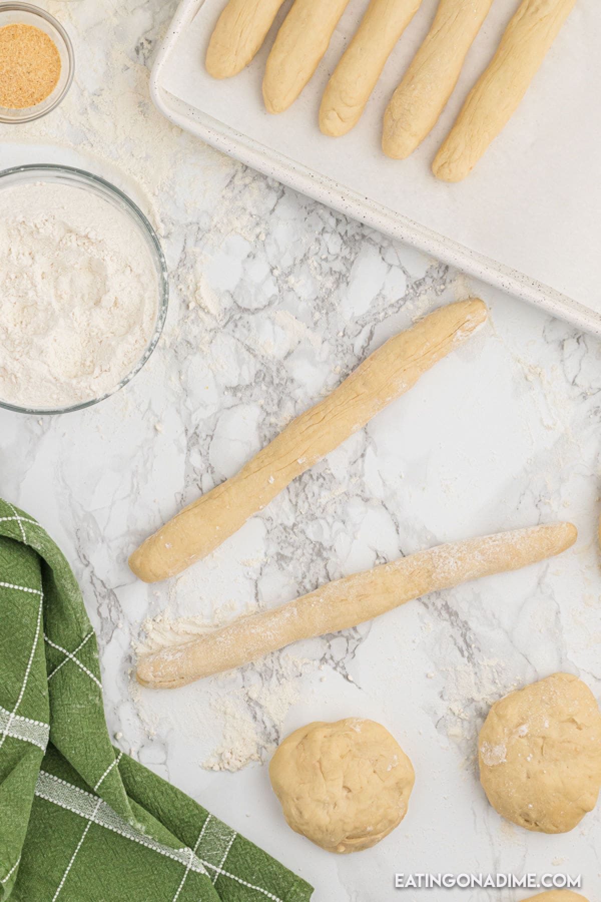 Rolling dough into breadsticks