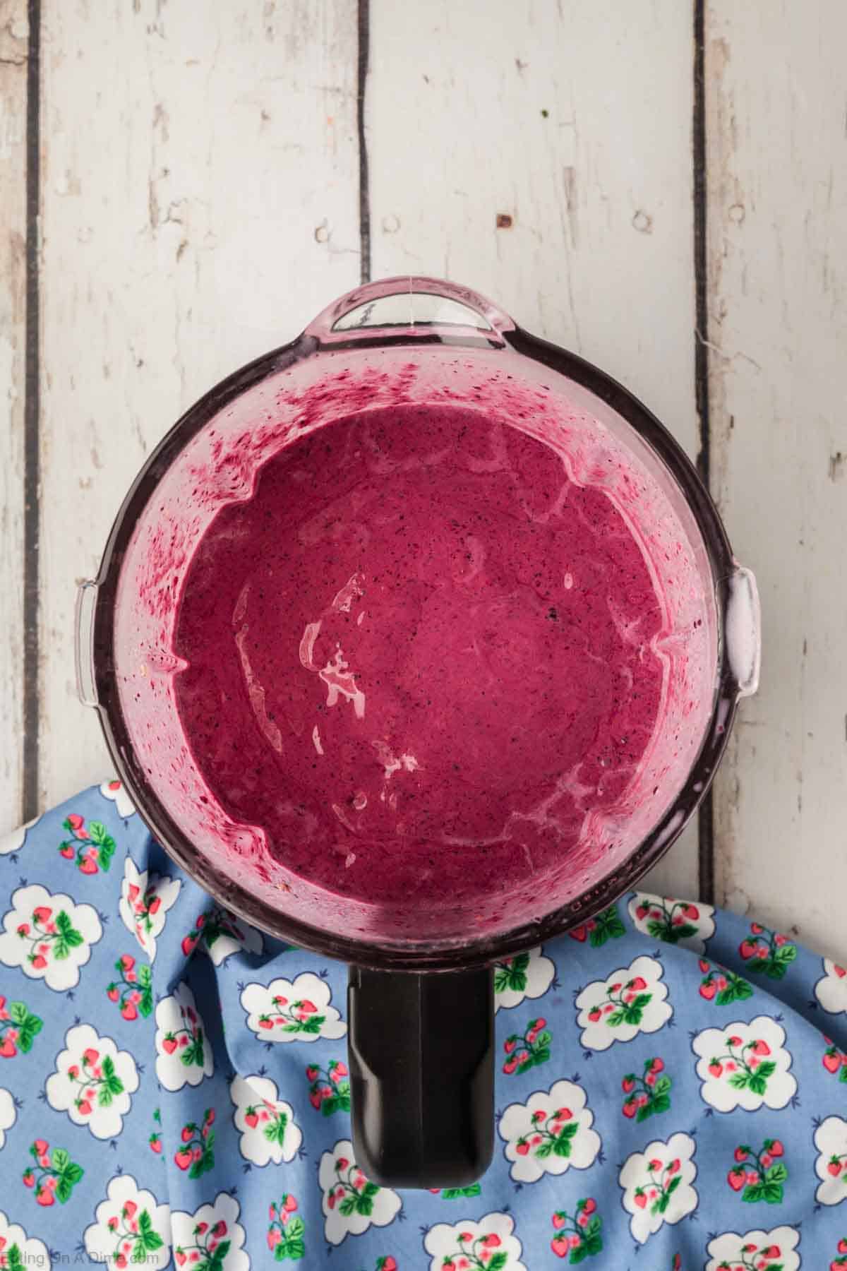 Blended smoothie ingredients in a blender pitcher