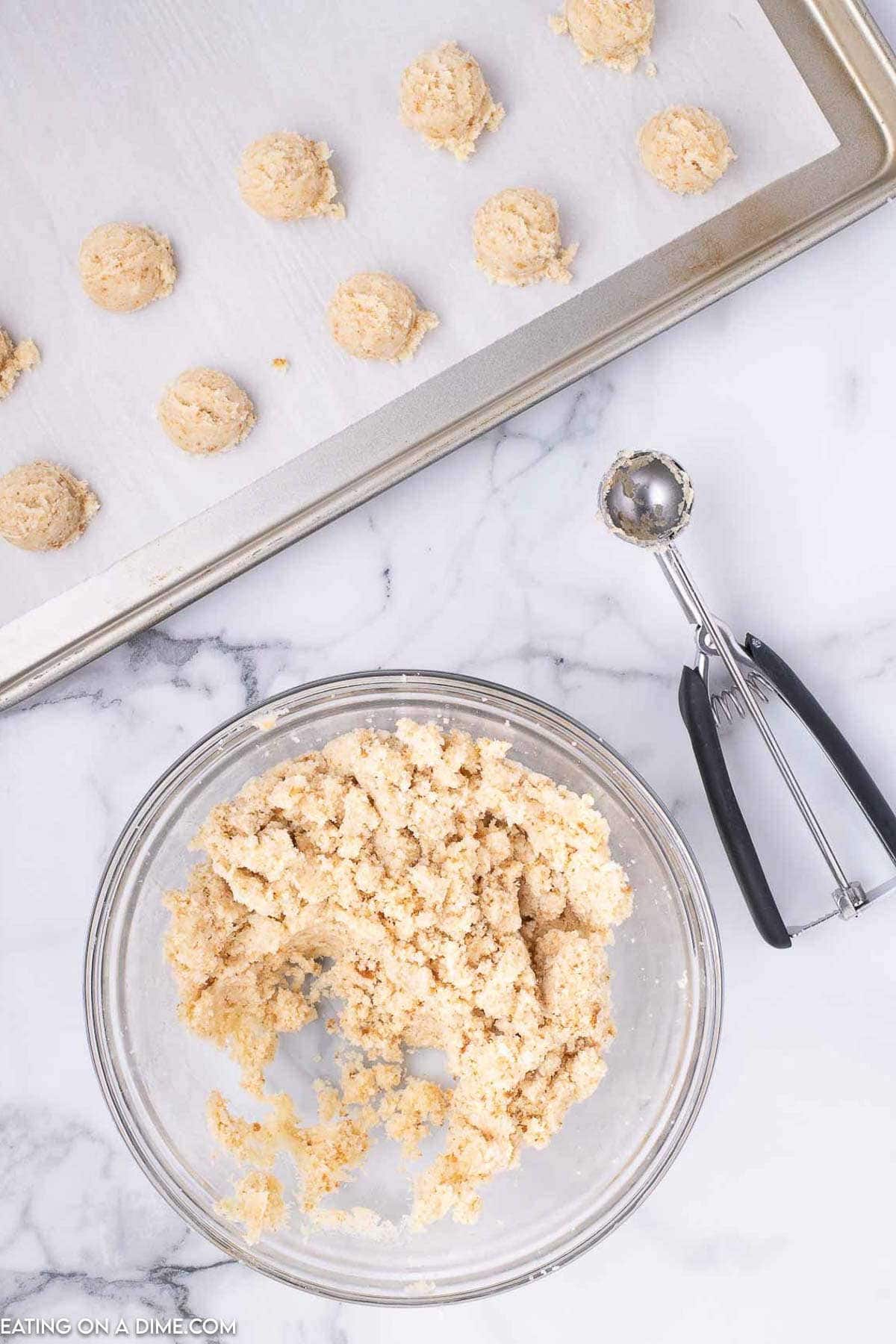 Shape the cake into cake balls and place on baking sheet