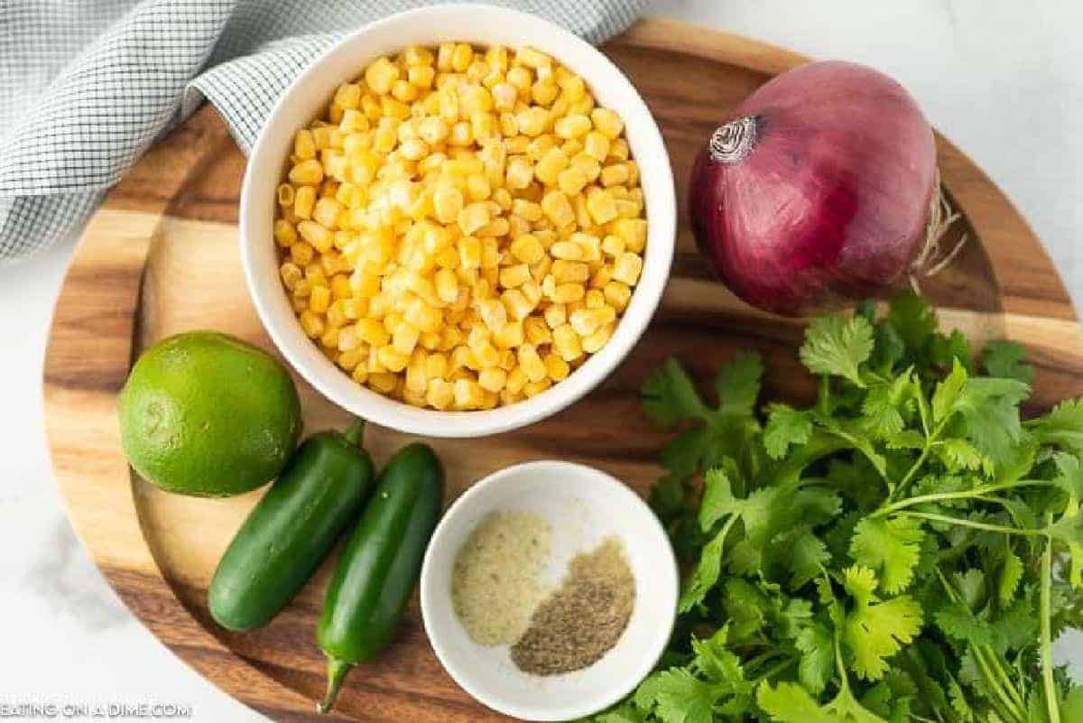 Corn Salsa Ingredients - Corn, red onion, jalapenos, cilantro, limes, garlic salt, pepper